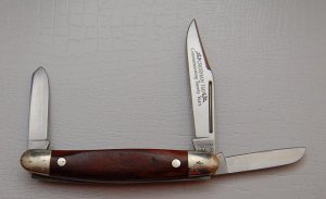 Western In Near Mint Condition With Wood Synthetic Covers 3 3/8