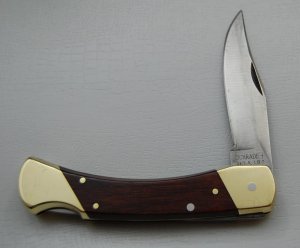Schrade In Excellent Condition With Resin Impregnated Hardwood Covers 5