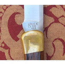 Buck 110 Folding Hunter in Walmart Gift Tin from 2005 still in shrink wrap