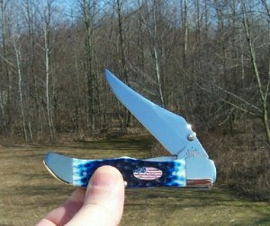 2003 CASE XX BLUE BONE MID FOLDING HUNTER W/ STARS & STRIPES SHIELD