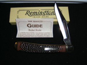 REMINGTON 1992 GUIDE R-1253  JIGGED DELRIN HANDLES SILVER BULLET