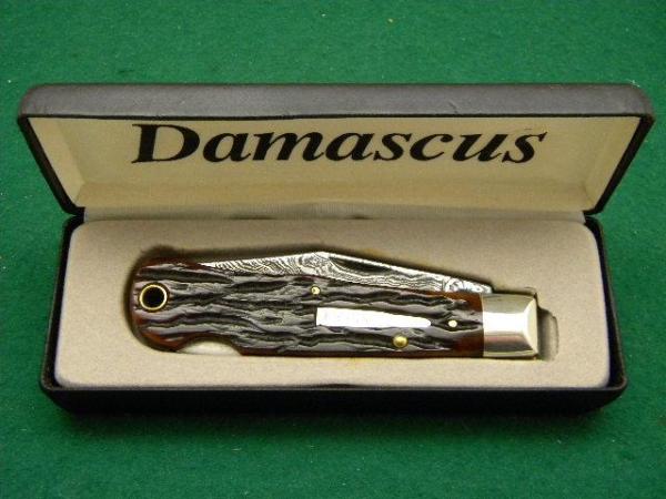 Remington UMC USA 1999 Genuine Bone R1303 Damascus Silver Bullet Lockback Knife - NIB Remington UMC USA 1999 Genuine Bone R1303 Damascus Silver Bullet Lockback Knife - NIB