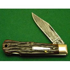 Remington UMC USA 1999 Genuine Bone R1303 Damascus Silver Bullet Lockback Knife - NIB Remington UMC USA 1999 Genuine Bone R1303 Damascus Silver Bullet Lockback Knife - NIB