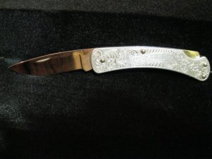 Buck 510 1-dot Engraved Aluminun knife. 