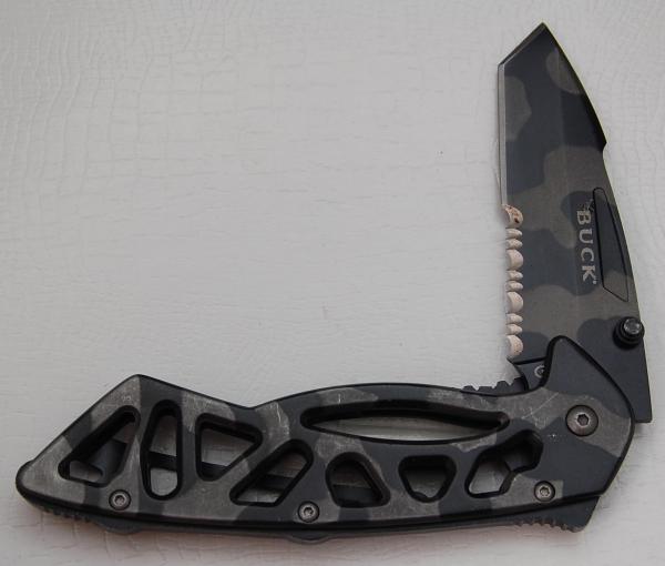 Buck with Camo Metal Covers In Very Good Condition (812) Buck with Camo Metal Covers In Very Good Condition (812)