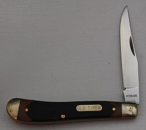 Schrade with Brown Sawcut Synthetic Covers In Very Good Condition (825)