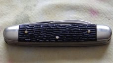 1950 Ulster Equal End 3 blade cattle knife.  Jigged black handles with 1950 safety award shield