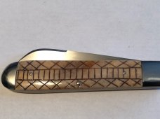 Ken Coats custom made folder scrat bone 