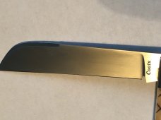 Ken Coats custom made folder scrat bone 