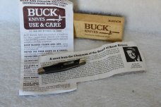 Buck Lancer 305 Cat.  481 Black saw cut delrin.  ^ (1988)