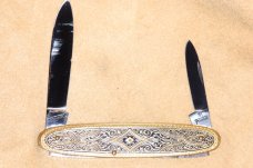 J.A. Henckels two blade folder. Brass with design on handle. Mint.