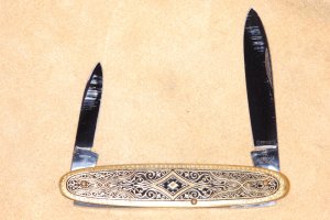 J.A. Henckels two blade folder. Brass with design on handle. Mint.