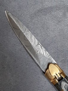 Lever lock knife. 