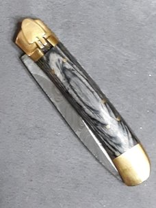 Lever lock knife. 