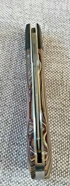 DrT custom Dino pattern, Fordite and Damascus, 3.75" closed , coa/slip.Fordite and westy worry coin 