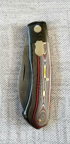 DrT custom Dino pattern, Fordite and Damascus, 3.75" closed , coa/slip.Fordite and westy worry coin 