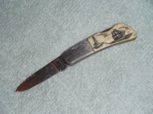 Vintage Single Blade Lock back knife with Highly Detailed Scrimshaw Ship passing a lighthouse scene