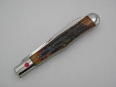 Queen Cutlery 5 3/8" slim coke bottle, carved amber stag bone handles: 2009,