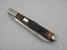 Queen Cutlery 5 3/8" slim coke bottle, carved amber stag bone handles: 2009,
