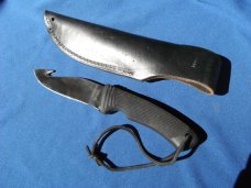CRKT Wind River 2001 Fixed Blade Knife w/gut hook and leather sheath.  