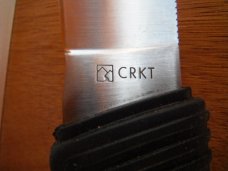 CRKT Wind River 2001 Fixed Blade Knife w/gut hook and leather sheath.  
