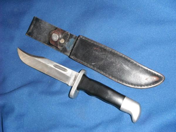 Jaguar fixed blade knife w/ sheath. Similar to a Buck 119.  Made in Japan???