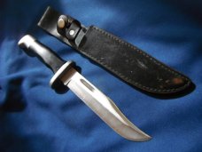 Jaguar fixed blade knife w/ sheath. Similar to a Buck 119.  Made in Japan???
