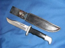 Jaguar fixed blade knife w/ sheath. Similar to a Buck 119.  Made in Japan???