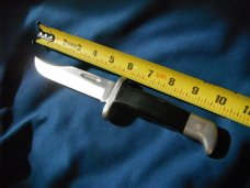 Jaguar fixed blade knife w/ sheath. Similar to a Buck 119.  Made in Japan???