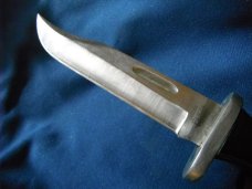 Jaguar fixed blade knife w/ sheath. Similar to a Buck 119.  Made in Japan???