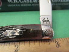 Case XX 2004 Brown Bone Scrolled Bolsters Tiny Texas Toothpick Pattern # 610096 SS