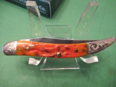 Case XX 2005 Orange Bone Scrolled Bolsters Tiny Texas Toothpick Pattern # 610096 SS