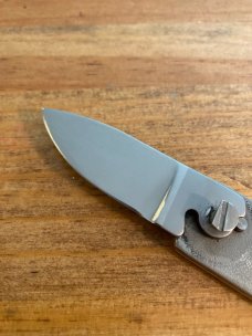 Gerber touché belt buckle knife wood grain and scrimshaw fish