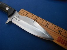 Custom handmade fixed blade knife with leather sheath.  A very sharp edge.