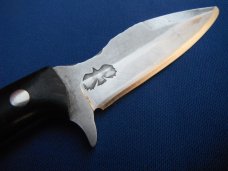 Custom handmade fixed blade knife with leather sheath.  A very sharp edge.