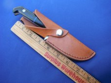 Custom handmade fixed blade knife with leather sheath.  A very sharp edge.