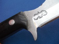Custom handmade fixed blade knife with leather sheath.  A very sharp edge.