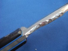 Custom handmade fixed blade knife with leather sheath.  A very sharp edge.