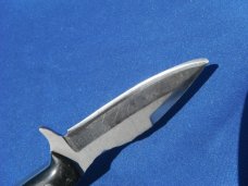 Custom handmade fixed blade knife with leather sheath.  A very sharp edge.