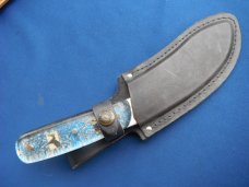 Custom handmade fixed blade skinning knife, camp knife with leather sheath.  A sharp edge.