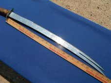Arab two prong tip Sword with original sheath.  Made in Iraq. Very sharp!!! 23.5" Blade 33.5 OAL.  