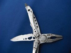 LEATHERMAN Skeletool Stainless Steel Multi-Tool, Pliers, Folding Knife, Phillips Half Serrated Blade