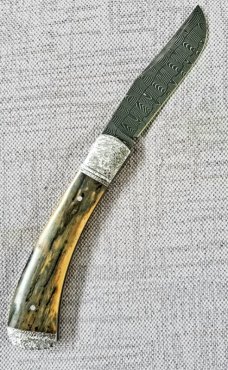 Brian Hoese Trapper..Mammoth And Damascus. 4.5" ...Hand tooled bolsters, shield,end caps and pins