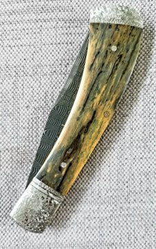 Brian Hoese Trapper..Mammoth And Damascus. 4.5" ...Hand tooled bolsters, shield,end caps and pins