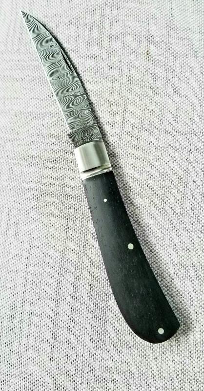 Pablo Castellani Custom Swayback slipjoint..Damascus and Ebony...4.25" ..integral fluted bolsters Pablo Castellani Custom Swayback slipjoint..Damascus and Ebony...4.25" ..integral fluted bolsters