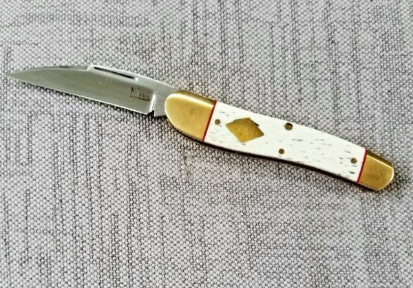 K'roo Custom Giraffe Bone Serpentine.3.5..slip..coa...rwl34..filework.red liners..spacers...brass