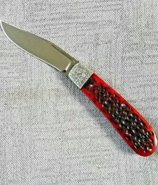 Rusty Preston Jigged bone Trapper.4 3/8" closed...Cpm154..crosshatched bolsters..coa with pouch