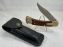 2003 BUCK USA 110 Wood Automatic Folding Hunter Lockback MINT IN POUCH 