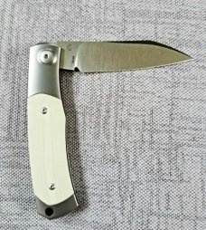 Viper Hug..Sacha Thiel Collab...Ivory G10..M390..4" closed...bolsters and caps w/tube...Leather slip