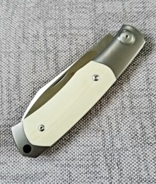 Viper Hug..Sacha Thiel Collab...Ivory G10..M390..4" closed...bolsters and caps w/tube...Leather slip